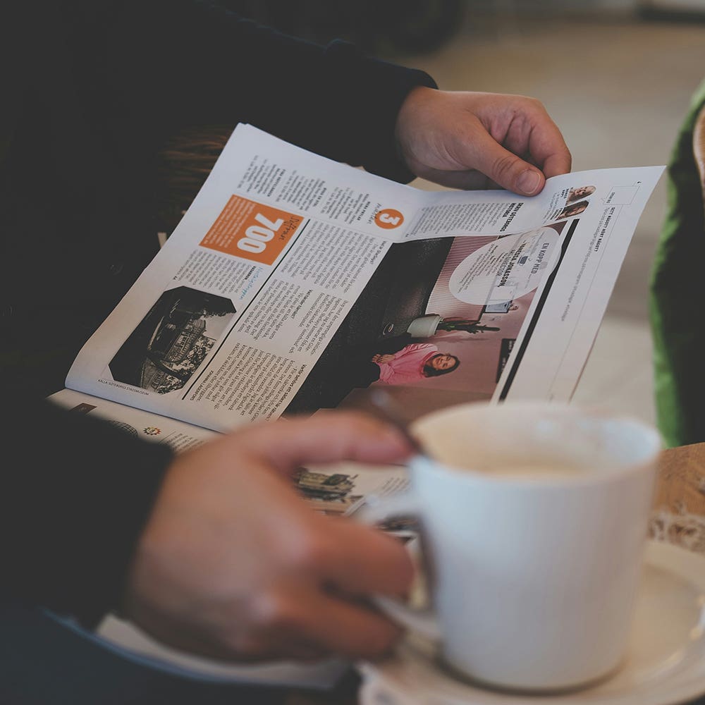 news writer training course - person reads a newspaper