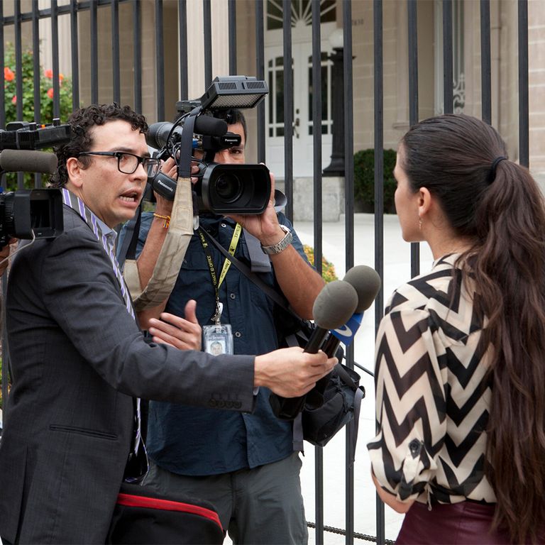 Woman being interviewed by a news crew
