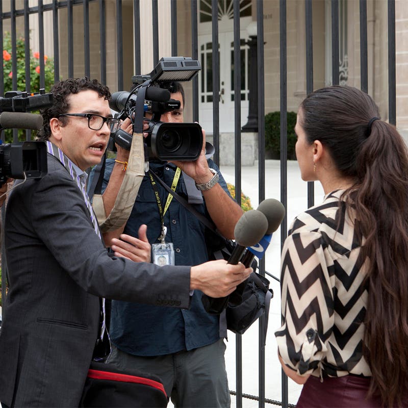 Woman being interviewed by a news crew