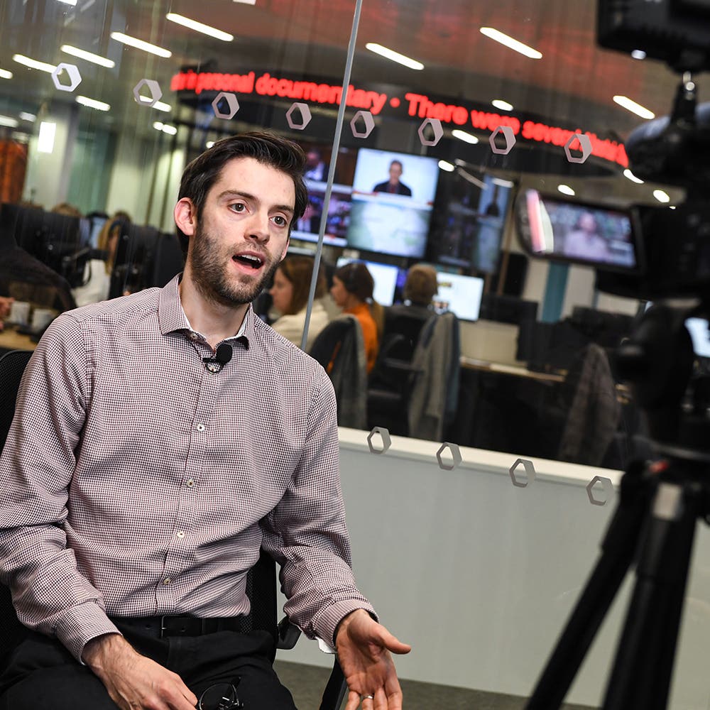 Spokesperson speaking to camera in the Press Association newsroom