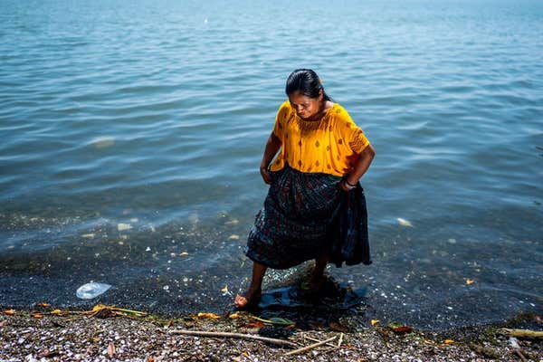 Sylvia Patricia Caal, 35, from Rubal Pec, stands in the waters of Lake Izabal in El Estor, Guatemala. The Mayan peoples struggle to keep their ancestral land has been described as the fourth conquest and like fighting a monster. Mayans have shown remarkable resilience in response, said a policy adviser with the Irish charity Trocaire. Picture date: Wednesday March 5, 2025.