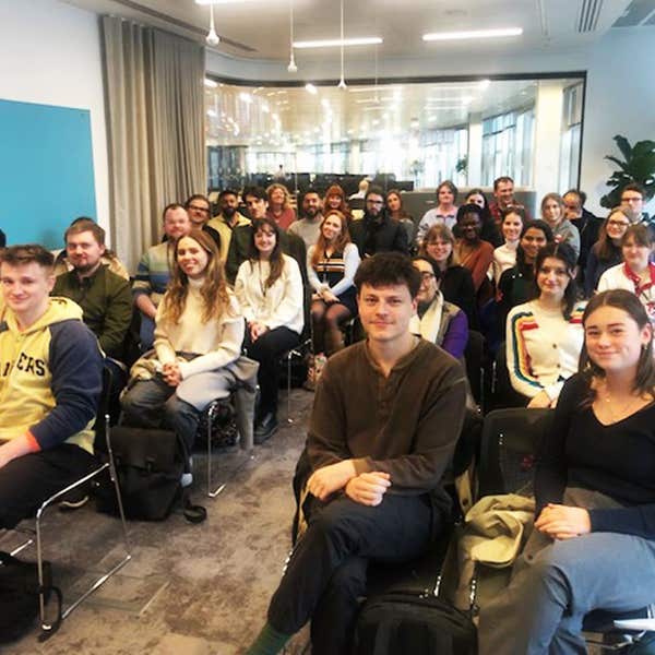 Cohort of trainee journalists seated together in a Press Association training room