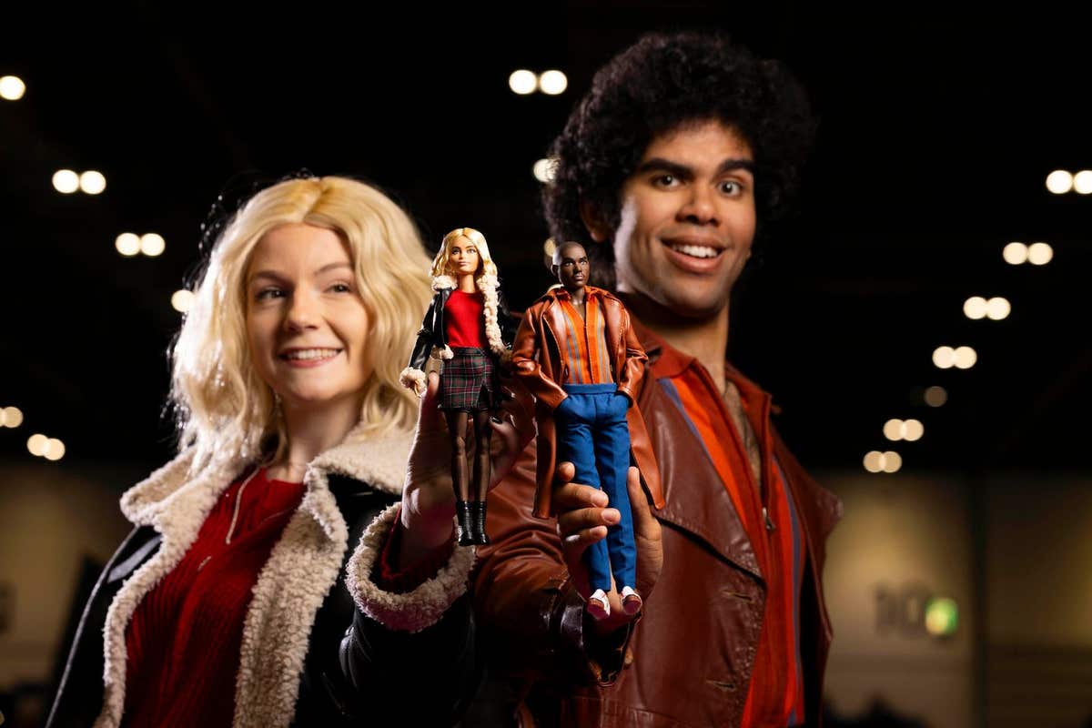 EDITORIAL USE ONLY Cosplayers Dominic G Martin and Charlotte Woolrych with the Doctor Who Barbie dolls, in the likeness of ac