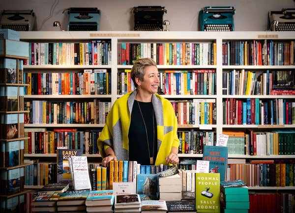 lady in a bookshop, that showcases high street business owners, as part of editorial photo's