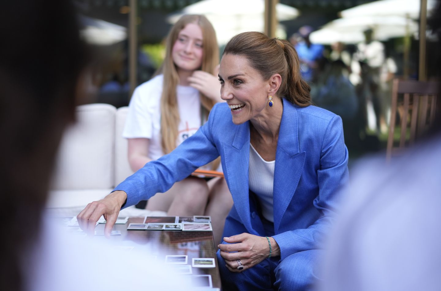 The Princess of Wales meeting children from Shine Camera Club, a creative photography programme based in the London Borough of Merton which supports children from disadvantaged backgrounds to develop confidence, creativity and self-expression through photography, on day four of the 2026 Wimbledon Championships at the All England Lawn Tennis and Croquet Club,