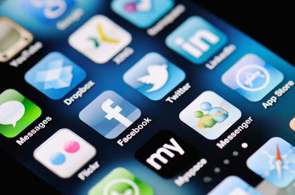 C5C9DP A close up of an Apple iPhone 4 screen showing the App Store and various social media apps