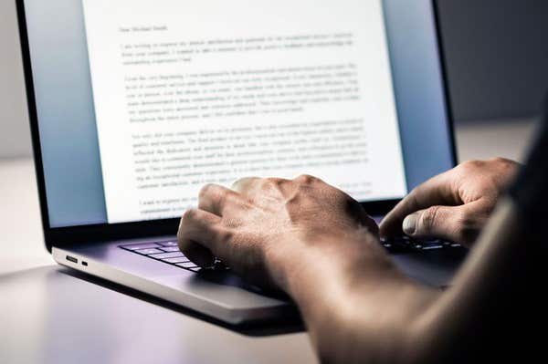3ATPE1J Writing. Blog writer. Content, article, letter with laptop computer. Text document, book, business report or journal.
