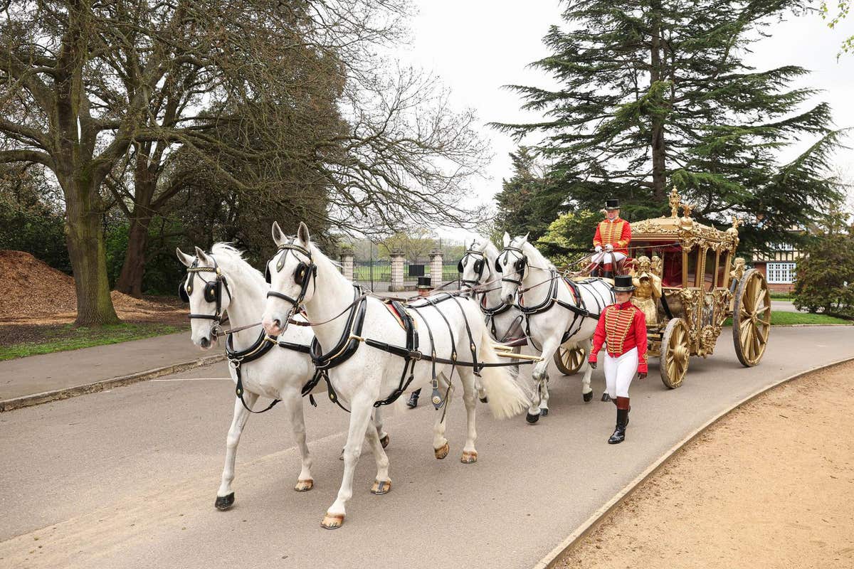 EDITORIAL USE ONLY A replica carriage resembling the one King Charles III will ride to his coronation is driven through Dulwi