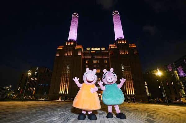 EDITORIAL USE ONLY The chimneys at Battersea Power Station in London are lit up pink as ‘Mummy Pig’ and ‘Daddy Pig’ from tele