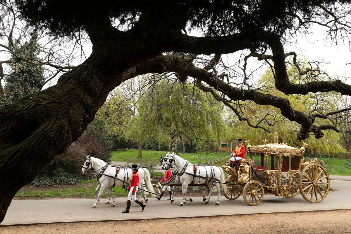 EDITORIAL USE ONLY A replica carriage resembling the one King Charles III will ride to his coronation is driven through Dulwi