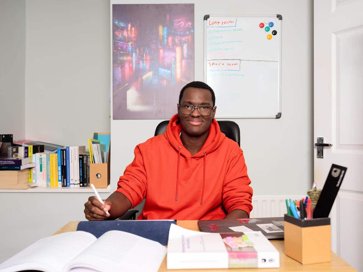 EDITORIAL USE ONLY Joe Acaye, a pharmacy assistant from Essex, who is studying to be a psychologist, has his portrait taken i