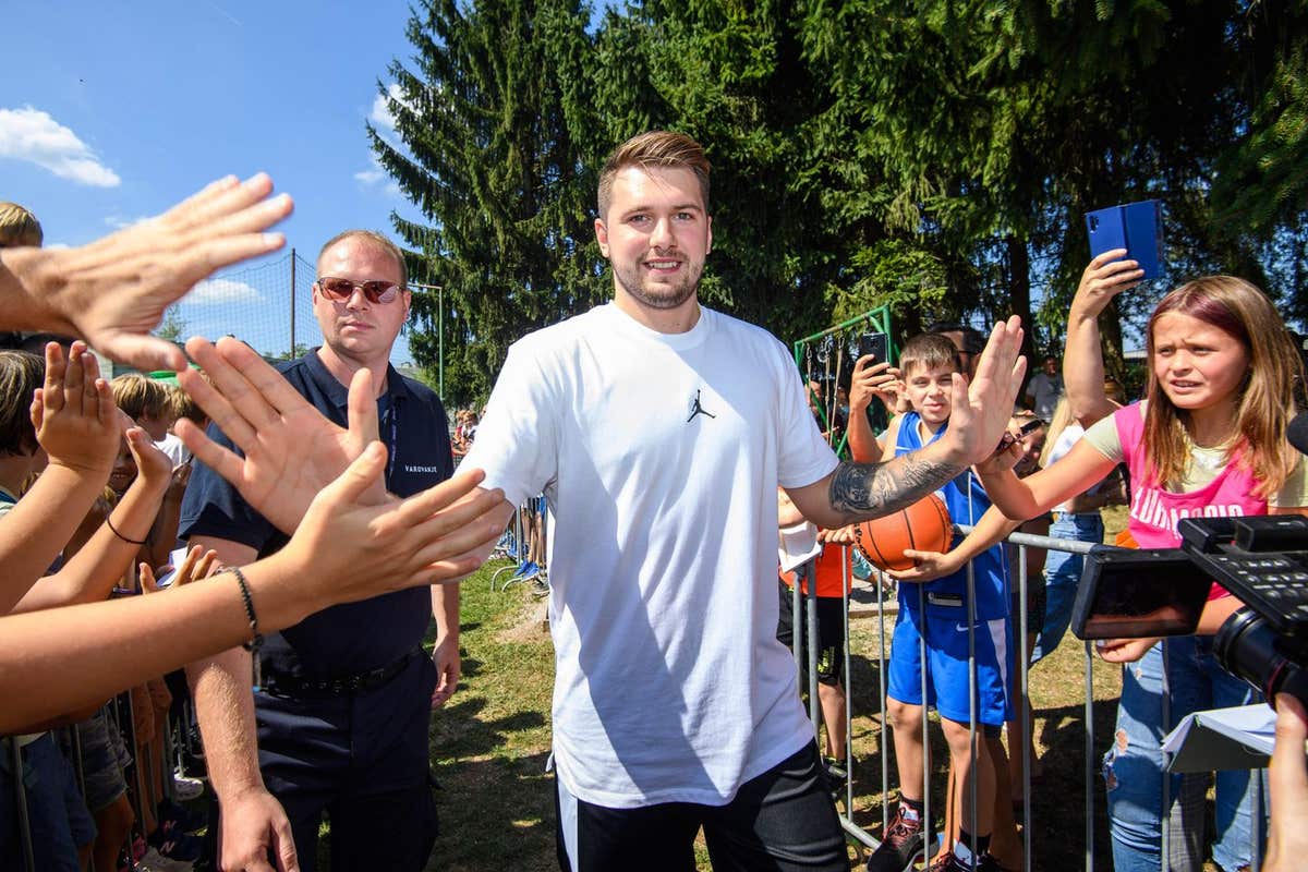 EDITORIAL USE ONLY Dallas Mavericks NBA All-Star Luka Doncic in partnership with 2K Foundations unveils two new refurbished b