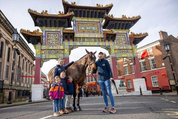 EDITORIAL USE ONLY Amy Bannister-Bell, Retraining of Racehorses Wales representative, and her family with racehorse Nora The 