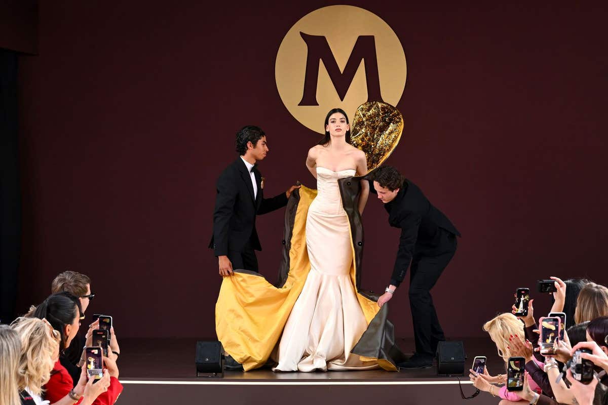 EDITORIAL USE ONLY A model walks during the Magnum couture runway presentation at the House of Magnum during the Cannes Film