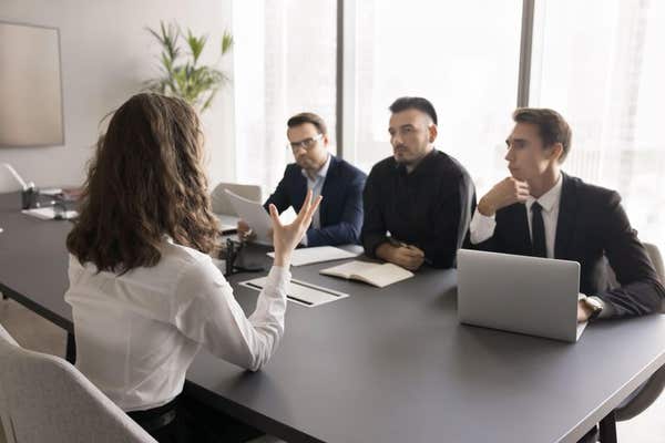 2SYGM2R Young lady feel bias on job interview with male recruiters