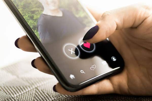 3CFR58R Date app. Woman and love. Online romance scam. Cheating, swiping right or stalker. Profile picture of a man. Virtual 