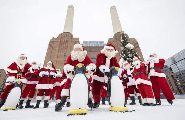EDITORIAL USE ONLY Father Christmas performers at Ministry of Fun’s annual Santa School ice skate at London’s only riverside 