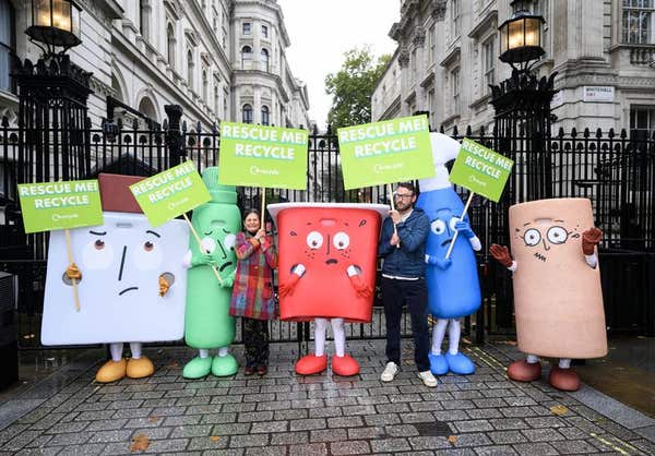 EDITORIAL USE ONLY JJ Chalmers and WRAP CEO Harriet Lamb, with costumed characters from global environmental action non-gover