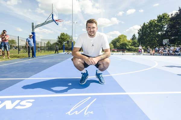EDITORIAL USE ONLY Dallas Mavericks NBA All-Star Luka Doncic in partnership with 2K Foundations unveils two new refurbished b