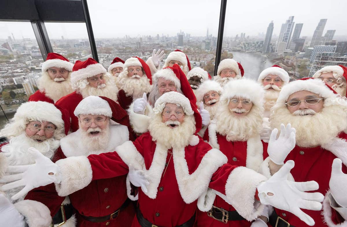 EDITORIAL USE ONLY Father Christmas performers at Ministry of Fun’s annual Santa School ice skate at London’s only riverside