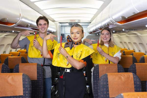 EMBARGOED TO 0001 MONDAY AUGUST 18 EDITORIAL USE ONLY Jason Cole and Millie Lambert take part in easyJet’s cabin crew taster 