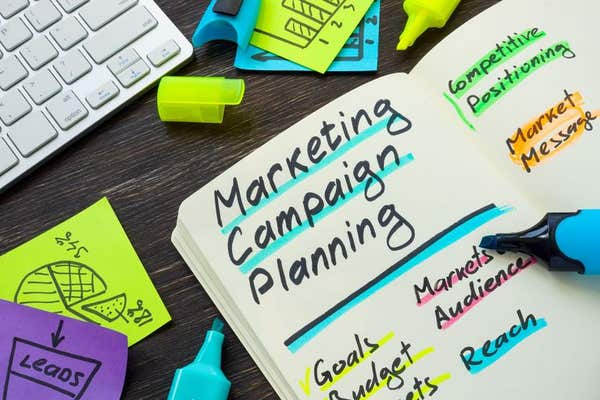 2FNHNEC Marketing campaign planning on the notepad pages.