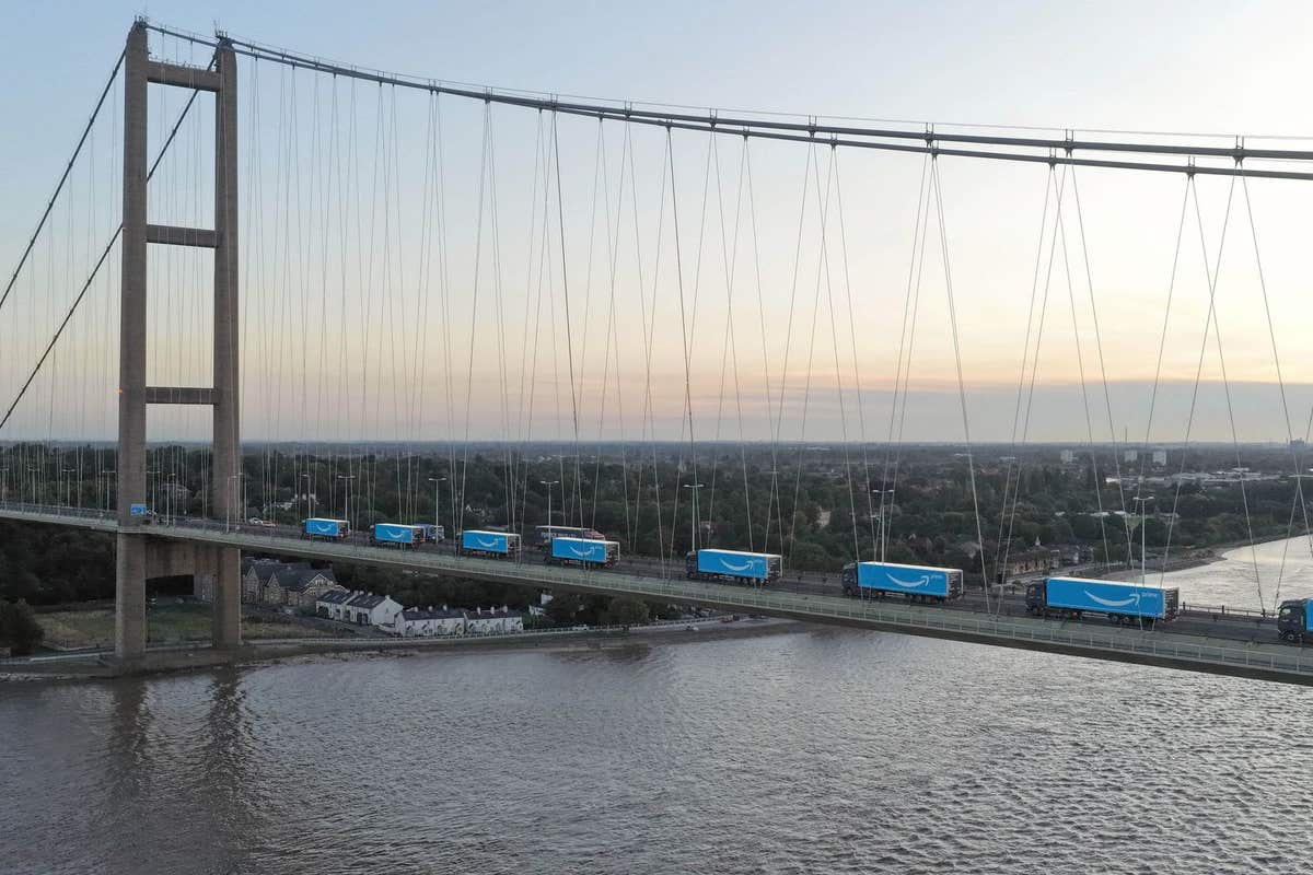 EDITORIAL USE ONLY A convoy of electric heavy-goods vehicles (eHGVs) arrive in the UK, across the Humber Bridge in Yorkshire,