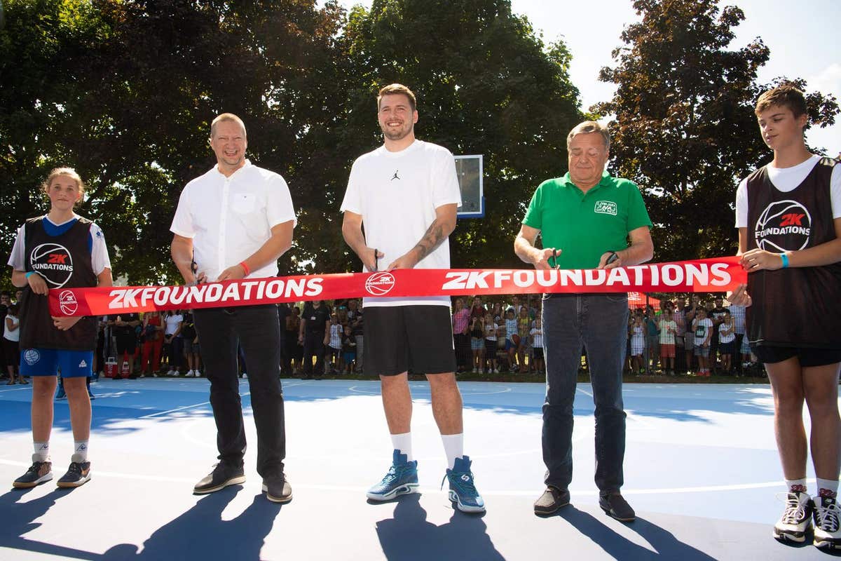 EDITORIAL USE ONLY Dallas Mavericks NBA All-Star Luka Doncic (centre) with Zoran Jankovic (right) Mayor of the City of Ljublj