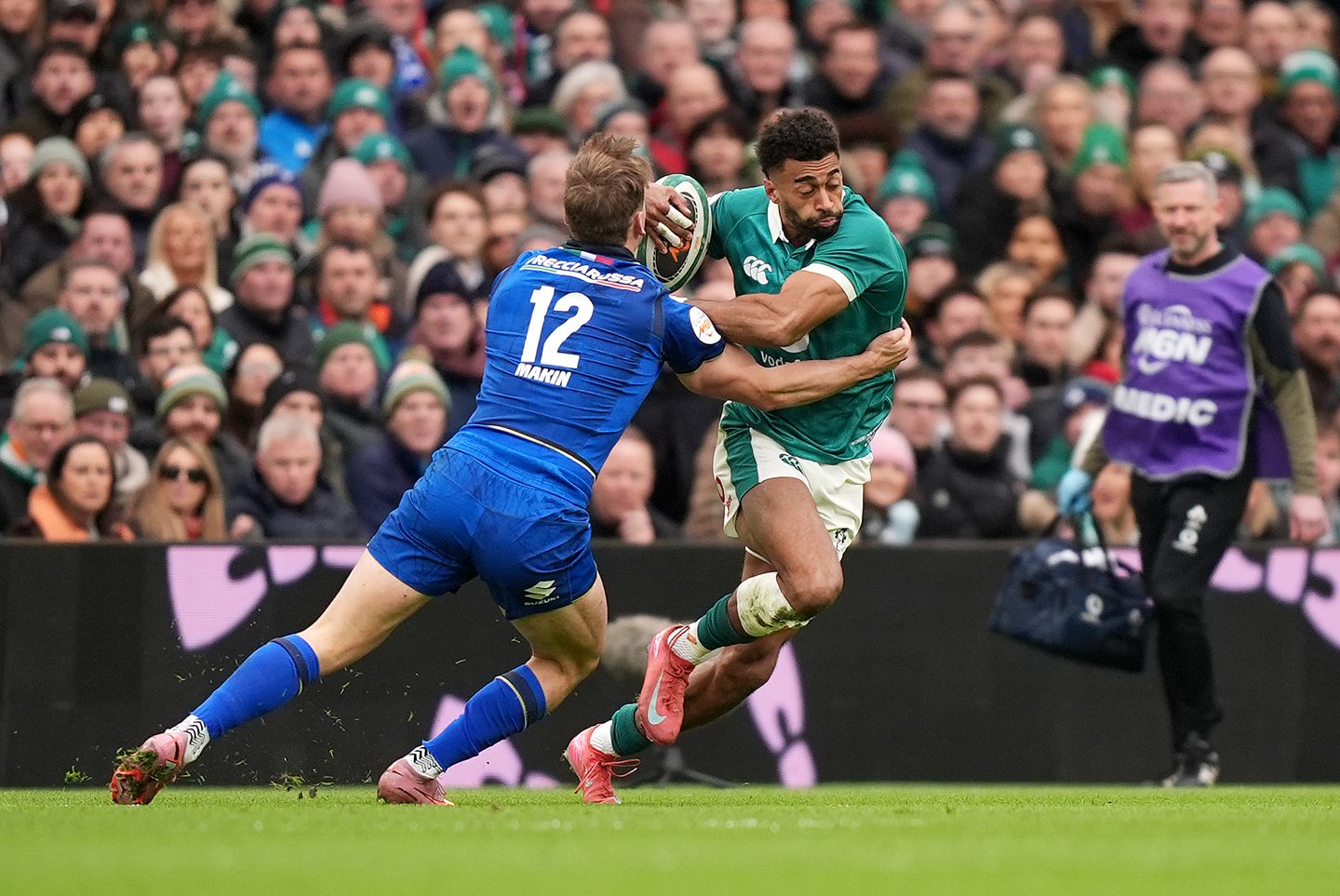 Ireland's Robert Baloucoune is tackled by Italy's Leonardo Marin (left) during the Guinness Men's Six Nations match at the Aviva Stadium, Dublin. 
