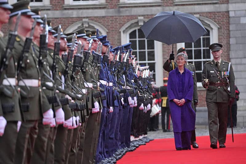 President Catherine Connolly reviews members of the Defence Forces in the Guard of Honour outside Dublin Castle after being inaugurated as Ireland's 10th president. 