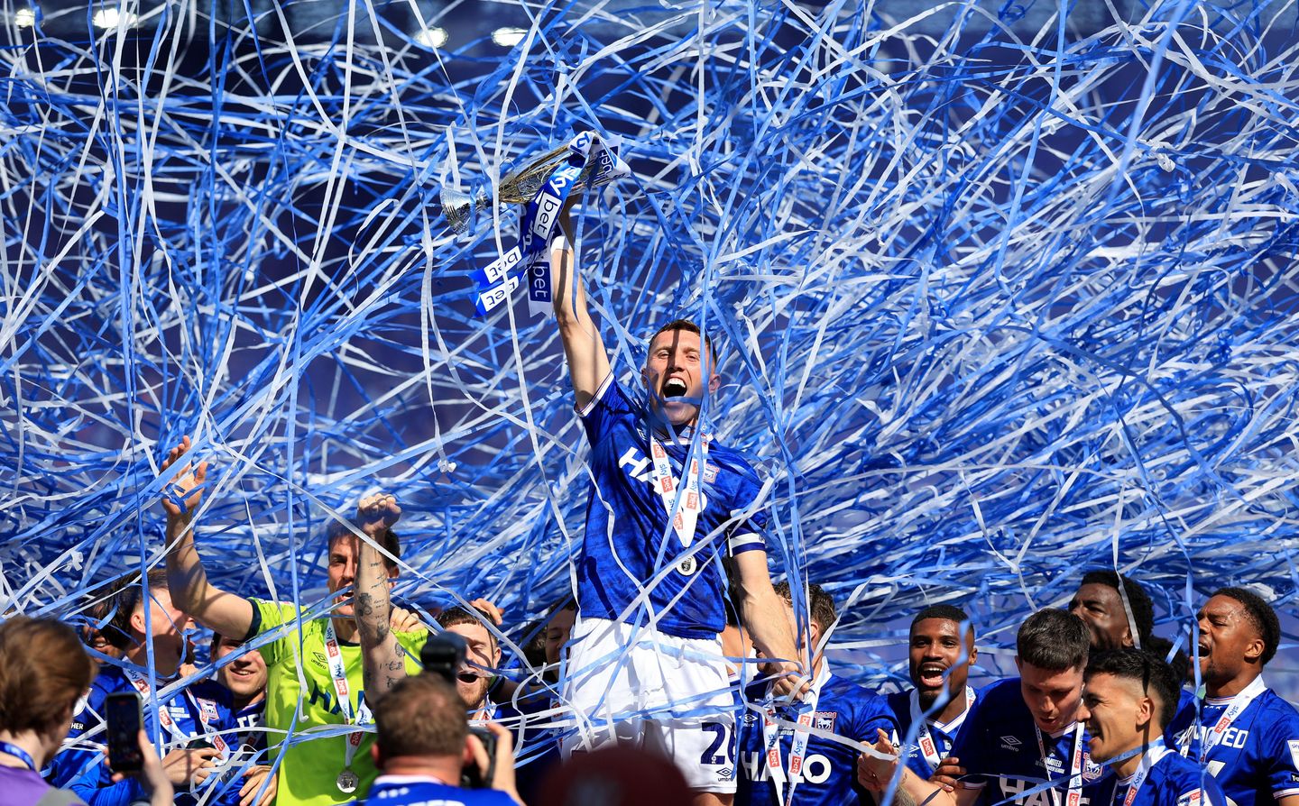 Ipswich Town's Dara O'Shea celebrates with the trophy on the pitch after Ipswich Town secured promotion following the Sky Bet Championship match at Portman Road, Ipswich. Picture date: Saturday May 2, 2026.