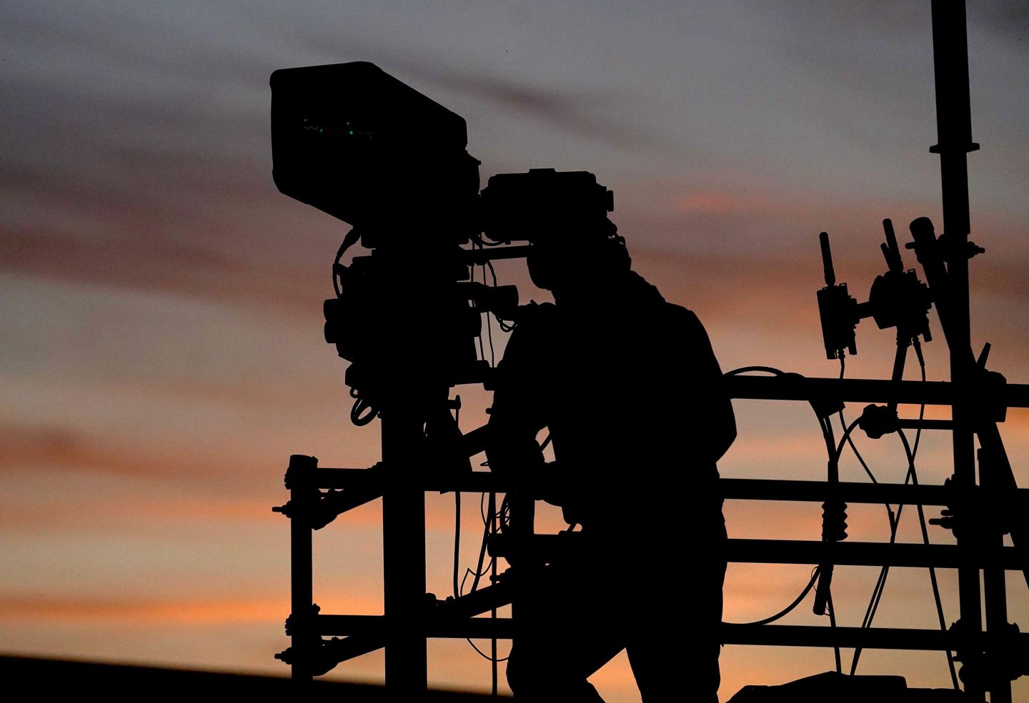 The silhouette of a camera man during the Sky Bet League One play-off semi-final, first leg match at Kassam Stadium, Oxford. Picture date: Saturday May 4, 2024.